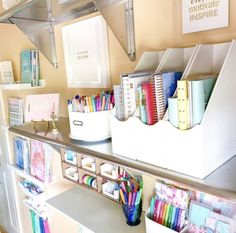 the shelves are organized with pens, pencils, and other office supplies on them