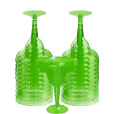 two green glass vases sitting next to each other