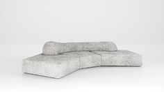 a gray couch sitting on top of a white floor