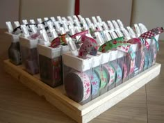 a wooden table topped with lots of cups