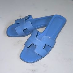 Authentic Hermes H Oran Sandals. Size 37. Comes With Box, Ribbon, And Dust Bags! Make An Offer Hermes Sandals, Box Ribbon, Hermes Shoes, Hermes Oran, Blue Sandals, Women's Shoes Sandals, Shoes Sandals, Dust Bag, Ribbon