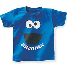 a blue t - shirt with an image of a cookie monster on it