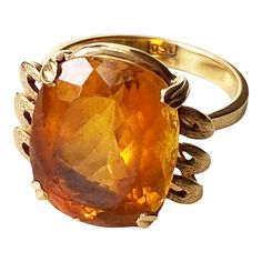 This classic 18K gold ring masterfully displays a magnificent Imperial Citrine quartz crafted in the shape of a large 06.2" x 0.5" x 0.3", weighing 6.5 grams. Size 6, ring size 1" h by 0.75" w by 0.50 " d The stone is set in a center prong style for eye-catching brilliance. This exquisite piece of jewelry is an ideal addition to any fine jewelry collection and provides excellent style and luxury. Citrine is more than just a beautiful gemstone; it carries a wealth of symbolism and cultural signif 18k Gold Ring, Fine Jewelry Collection, Quartz Ring, Cocktail Rings, Citrine, Gold Ring, Gold Rings, Jewelry Collection, 18k Gold