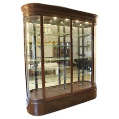 a display case with glass doors and shelves