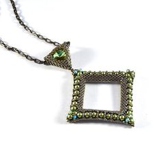 a necklace with a square shaped beaded pendant