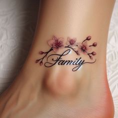 a woman's foot with the word family tattooed on it