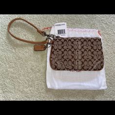 Brand New With Tags! Tan/Brown Signature C Cloth Pattern With Tan Leather Trim. Measurements Shown In Images. Brown Coach Bag With Wrist Strap, Brown Pouch Wristlet For Travel, Everyday Brown Wristlet With Removable Pouch, Coach Brown Wristlet With Zipper Closure, Brown Wristlet With Zipper Pouch For Daily Use, Everyday Brown Wristlet With Zipper Pouch, Coach Brown Wristlet With Removable Pouch, Brown Coach Wristlet With Removable Pouch, Brown Coach Wristlet Pouch