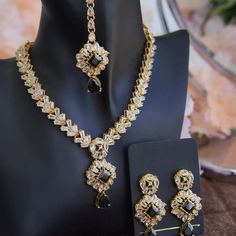 Beautiful necklace set includes a necklace, earring and tikka. It is available in black and dark blue colors. Elegant Black Kundan Jewelry, Elegant Black Kundan Necklace, Elegant Black Jewelry Sets For Festive Occasions, Black Kundan Necklace For Wedding And Festive Occasions, Elegant Black Kundan Necklace For Celebrations, Festive Black Kundan Necklace For Wedding, Black Bollywood Jewelry For Wedding, Black Necklace For Wedding And Festive Occasions, Black Bollywood Style Jewelry For Wedding