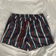 Never Worn Men Swim Shorts Red Swim Trunks For Spring Vacation, Casual Striped Short Swim Trunks, Casual Multicolor Swim Trunks With Pockets, Red Cotton Swim Trunks For Summer, Red Summer Shorts For Poolside, Red Bottoms With Pockets For Beach Season, Red Cotton Swim Trunks For Beach, Red Cotton Swim Trunks For The Beach, Red Swim Trunks For Spring