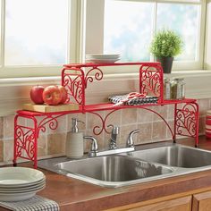 a kitchen counter with a sink, dishwasher and two plates on top of it