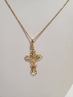 "You are viewing a beautiful 24k.solid gold Jesus cross pendant. The pendant total weight approx. 3.64 grams. NOTE : CHAIN NOT INCLUDED The pendant measures approx.1 3/4 inches tall x 7 /8 inches wide.. The cross marked 14k at the back. The cross pendant is nicely carved with Jesus on the cross , diamond cut style so its spark in any angle as you wear it. Please take a closer at the video and photos. When listing and describing our items we make a conscious effort to over describe all imperfecti Yellow Gold Plated Cross Pendant Necklace, Gold Plated Yellow Gold Crucifix Necklace, Yellow Gold Plated Crucifix Cross Necklace, Gold-plated Yellow Gold Crucifix Necklace, Yellow Gold Crucifix Cross Necklace, Gold Plated, Yellow Gold Hallmarked Crucifix Cross Necklace, Hallmarked Yellow Gold Crucifix Necklace, Jesus Cross, Flower Ball