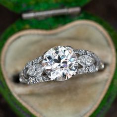 an engagement ring in a heart shaped box