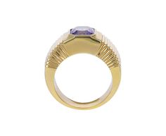 Striking in its intense color and modern design, this Retrouvai ring has a breathtaking presence. The rectangular blue-lavender tanzanite is set vertically and bezel set within the tiered 14K yellow gold polished band. Wear it as a statement making alternative to the traditional cocktail ring. It is a modern classic. tanzanite : 7.5mm x 7mm : 2.41ct14K yellow gold band width : 5mm to 9mmsize available : 6.5please contact us for sizing options Modern Yellow Gold Sapphire Ring For Formal Events, Modern Yellow Gold Sapphire Ring For Formal Occasions, Rectangular Yellow Gold Sapphire Ring For Formal Occasions, Yellow Gold Rectangular Sapphire Ring For Formal Events, Modern Sapphire Ring With Bezel Setting For Formal Events, Formal Yellow Gold Sapphire Ring With Rectangular Shape, Formal Rectangular Sapphire Ring In Yellow Gold, Modern Tanzanite Rings, Modern Formal Rings With Fluted Bezel