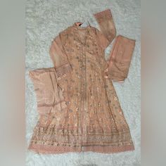 Pakistani Attire, Desi, South Asian, Handmade/Embroidery. Color: Peach Size: M, 42 (Medium) Materials* Dress/Top: Inner Is Raw Silk, Outer Is Chiffon, Embroidery, Lace Dupatta/Scarf: Chiffon, Embroidery Pakistani Attire, Suit Gown, Chiffon Embroidery, Three Piece Suit, Handmade Embroidery, Embroidery Lace, South Asian, Dress Top, Raw Silk