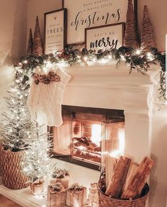 a fireplace decorated with christmas decorations and stockings