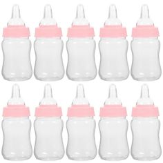 baby bottles with pink lids are lined up