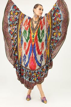 Multi color kaftan crafted in silk base with abstract print and ruffle edges.
Components: 1
Pattern: Print
Type Of Work: Abstract
Neckline: V Neck
Sleeve Type: Batwing Sleeves
Fabric: Silk
Color: Multi Color
Other Details: 
Geometric print edges
Occasion: Resort - Aza Fashions Spring Bohemian Kaftan With Abstract Print, Silk Kaftan With Digital Print Tunic, Multicolor Boho Print Kaftan With Kimono Sleeves, Bohemian Multicolor Kimono Sleeve Dress, Bohemian Dresses With Kimono Sleeves In Multicolor Print, Bohemian Dress With Multicolor Print And Kimono Sleeves, Bohemian Multicolor Tunic With Vibrant Print, Bohemian Dresses With Kimono Sleeves And Multicolor Print, Bohemian Silk Dresses With Abstract Print