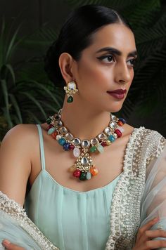 This navrattan necklace set with its pop of colors and quirky shapes is a sublime piece. The subtelty of the polki with hints of muted golden tones creates the perfect balance to create a winning look. Necklace Closure - Adjustable Dori Earrings Closure - Push Back Style Tip - This multicolored piece of art is perfect for gracing traditional funtions in full pomp and show. Navrattan itself being the traditional epitome of prosperity, wealth and status. What could be better than Handcrafted in Ja Fusion Style Multicolor Kundan Necklace For Party, Party Multicolor Fusion Kundan Necklace, Party Style Fusion Multicolor Kundan Necklace, Party Fusion Style Multicolor Kundan Necklace, Festive Multicolor Beaded Jewelry, Multicolor Handmade Kundan Necklace For Party, Multicolor Kundan Fusion Necklace, Handmade Multicolor Kundan Necklace For Party, Multicolor Festive Necklace For Parties