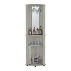 a tall wooden shelf with bottles and glasses on it