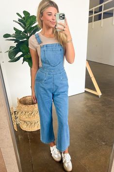 Details: Looking for a unique take on overalls? Look no further than our Mineral Washed Knot Strap Overalls! These overalls feature adjustable straps with a playful knot detail, giving them a relaxed fit that's perfect for any occasion. With a washed finish, you'll stand out in the best way possible. Plus, the relaxed fit means you'll be comfortable all day long! - Denim- Pockets - Relaxed fit Content: 80% Cotton 18% Polyester 2% Spandex. Size + Fit: Model is 5'8" and wearing a Small - Measureme Overalls Disney Outfit, Overalls No Shirt, Women’s Overalls, Wide Leg Overalls Outfit, Jean Overalls Outfit, Blue Overalls Outfit, Long Overalls Outfit, Summer Overall Outfits, Jean Jumpsuit Outfit