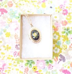 "A gorgeous gold plated photo locket adorned with a lovely vintage black glass limoges with yellow rose dangles so pretty from a 16k gold plated link chain with lobster clasp. Locket has a lovely etched pattern Total length of chain measures 18\" Locket measures 23x30mm Cameo measures 18x13mm Locket is high quality and nickel free Matching bracelet available in my shop as shown in photo 4 (sold out) Your purchase will come beautifully wrapped ready for gift giving" Vintage Gold Jewelry With Birth Flower, Vintage Gold Jewelry With Birth Flower Detail, Vintage Yellow Gold Jewelry With Birth Flower, Vintage Birth Flower Medallion Jewelry, Vintage Medallion Jewelry With Birth Flower, Vintage Pressed Flowers Keepsake Jewelry, Vintage Pressed Flowers Jewelry Gift, Vintage Pressed Flowers Jewelry Keepsake, Vintage Jewelry With Pressed Flowers For Gifts