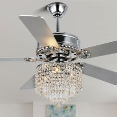 a ceiling fan with a crystal chandelier hanging from it's center blade