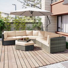 an outdoor living area with patio furniture and umbrella