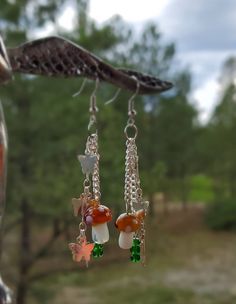 These earrings are lightweight and inspired by fairycore. Glass Mushroom Earrings, Nickel Free Fairycore Dangle Earrings, Nickel-free Fairycore Dangle Earrings, Fairycore Nickel-free Dangle Earrings, Fairycore Drop Earrings, Fairy Grunge Dangle Earrings, Goblincore Earrings, Bedroom References, Mushroom Things