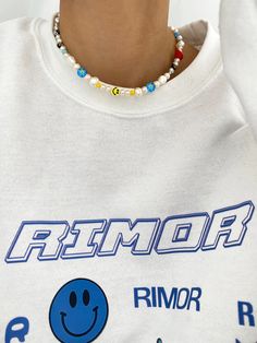 SMILEY FACE PEARL CHOKER NECKLACE – Rimor Jewelry Trendy White Necklace For Spring, Casual White Necklace With Letter Beads, Casual White Necklaces With Letter Beads, Casual White Letter Beads Necklaces, Trendy White Necklace With Letter Beads, White Casual Choker Necklace, Casual White Choker Necklace, Trendy White Beaded Necklaces For Festivals, Trendy White Beaded Necklace For Festivals