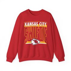 This retro looking crewneck sweatshirt is perfect for any Swiftie that's a fan of Kansas City. GARMENT FEATURES: * 50% cotton, 50% polyester * Ribbed crew neck * Runs true to size * Gildan  FIT & SIZING * Unisex sizing. Ladies, you may want to size down. RETURNS & EXCHANGES .: In the rare case that your item arrives misprinted or damaged, please reach out to us within 2 days of receiving your order so I can make it right. .: Since all items are made to order, returns and exchanges are not accepted. Please double-check your order info including sizing and address before placing your order as it is not guaranteed you will be able to cancel or change your order once fulfillment begins. WASHING INSTRUCTIONS .: Wash inside out in cold water, on a gentle cycle. Tumble dry low or let air dry. Avo Taylor Sweatshirt, Chief Clothes, Travis Taylor, Taylor Boyfriend, Football Sweater, Kansas City Football, Retro Sweatshirts, Football Sweatshirt, Kc Chiefs