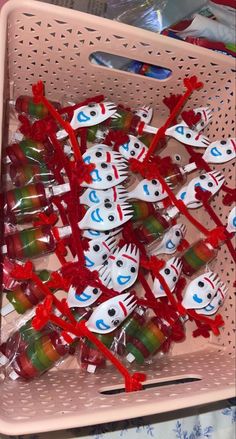 a pink basket filled with lots of toothbrushes covered in frosty snowmen