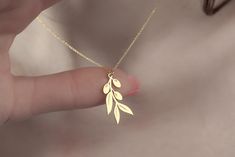 Olive Branch Necklace 14K Gold Plated Silver Necklace Minimal Jewelry Dainty Necklace 925 Sterling Silver Mothers Day Gift Summer jewelry Peace Symbol SM Jewelry Design House A nice gift for you and your loved ones. Free shipping within the USA on all orders Your order will be carefully prepared for you within 3-5 working days and will be shipped in a special gift box. 925 Sterling silver necklace, Suitable for sensitive skin and daily use Materials All of our jewelry is handcrafted using 925 st Gold Sterling Silver Charm Necklace For Mom, Dainty Sterling Silver Jewelry Stamped 14k, Delicate Sterling Silver Necklace Stamped 14k, Dainty Collarbone Chain Jewelry As Gift For Mom, Dainty Clavicle Chain Jewelry As Gift For Mom, Dainty Tarnish-resistant Necklace For Mom, Gold Sterling Silver Necklace As Gift For Mom, Sterling Silver Gold Necklace For Mom, 14k Gold Delicate Chain Jewelry As Gift For Mom