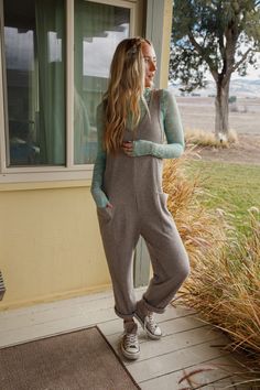 Calling all of our wild things, we have the jumpsuit for you; the Running Wild Relaxed Pocketed Jumpsuit! So, so cozy with a fun design, you're going to love this sweater because it features: Comfortable, stretch, waffle knit fabric Relaxed and loose jumpsuit silhouette Flattering scoop neck and backline with thick tank top straps and dropped armholes Convenient oversized patched pockets Classic, loose, straight pant legs (Consider rolling the ankle for a cute detail!) Wear it alone or layered o Cozy Winter Loungewear Jumpsuits And Rompers, Relaxed Fit Long Sleeve Jumpsuits And Rompers For Lounging, Relaxed Fit Long Sleeve Jumpsuit For Lounging, Casual Fall Jumpsuits And Rompers For Loungewear, Casual Fall Loungewear Jumpsuits And Rompers, Winter Loungewear Long Sleeve Jumpsuits And Rompers, Casual Ribbed Jumpsuits And Rompers, Casual Gray Jumpsuits And Rompers For Lounging, Gray Jumpsuits And Rompers For Fall Loungewear