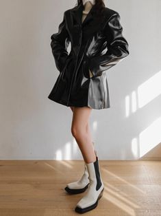 A stunning vegan leather jacket style dress that mimics a long blazer. Classic silhouette, oversized collar and button through front. Made from 100% quality PU. Model is in MINUSEY S. ✔️ Free worldwide express shipping over $100✔️ Loved by 6,500+ customers✔️ Limited edition collections, maximum style⠀⠀⠀⠀⠀⠀⠀⠀⠀Stay ahead of the trend with can’t-find-anywhere-else staples. Your closet will thank you 💕* MINUSEY S = EU 34, US 2* MINUSEY M = EU 36, US 4* 100% PU Leather* Dry clean* Made in Korea - Model Height: 172cm/5'7" (US 2, EU 34) Sleek Single Breasted Blazer Dress For Spring, Sleek Single-breasted Blazer Dress For Spring, Sleek Fall Business Blazer Dress, Sleek Blazer Dress For Business In Fall, Sleek Blazer Dress For Business In Spring, Sleek Blazer Dress For Fall Business Events, Sleek Spring Blazer Dress For Business, Sleek Spring Business Blazer Dress, Trendy Fall Blazer Dress With Lapel Collar