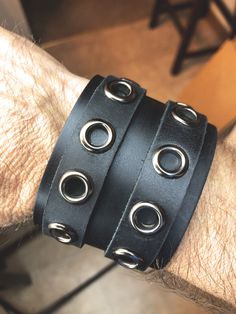 "Genuine leather cuff featuring 2 adjustable straps that are crafted into the body of the piece so they won't slip out of alignment. The cuff width is 2\" wide and with the adjustment holes in the straps, this one can accommodate anyone with a wrist size from 7\" up to 8\" This one is stylish and can be worn for almost any occasion whether you're headed to the concert, you are the concert, or just a night on the town. Great look for rockers, punks, bikers, or simply worn with a button down and j Button Down And Jeans, Leather Wrist Cuff, Rocker Outfit, 7 Up, The Concert, Punk Outfits, Wrist Cuffs, Gothic Jewelry, Leather Cuffs