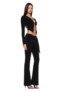 Details Best-selling Kamalei Pant is back! Black pants featuring asymmetrical buckle Full-length and flared silhouette Mid-rise and ruched waistband Adjustable belt closure Pull-on construction - Slip into with ease Unlined - This fabric is not sheer Due to fitting of this garment, we recommend a seamless brief or g-string Size and Fit True to size. We recommend wearing your standard size Mid Rise Waist - Sits approximately 8cm below smallest point of waist Flared leg - Fitted through hips and t V Pants Outfit, Fanci Club Pants, Black Bra Outfit, Flared Black Pants, Black Flair Pants Outfit, Going Out Pants, Flare Pants Outfit, Black Club Outfit, Black Flare Pants Outfit