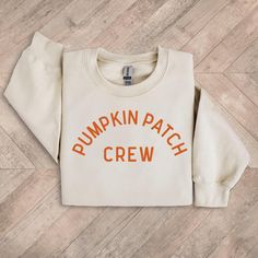 Pumpkin Patch Crew graphic in cream on front of sweatshirt or t-shirt. Perfect for all your Fall activities (pumpkin patches, apple picking, Thanksgiving etc.) to show off your love for Fall/Autumn spirit! Personalization: 1. Type the color of graphic that you would like. Choice of Cream or Orange ONLY. (As pictured.) Adult Sizes S-XXL (unisex sizing) Youth Sizes S-XL (unisex sizing) Sweatshirt colors vary. Toddler Sizes 2T, 3T, 4T (T-shirt only) Baby Bodysuits 6 Months, 12 months, 18 Months Gildan 18000 Heavy Blend, Port & Co, Jerzzees (availability varies) 50/50 cotton/polyester Classic, unisex fit 1x1 rib with spandex Bella + Canvas (Adult, Youth & Toddler Tees) 4.2 oz. Airlume combed and ring-spun cotton Pre-shrunk For a more relaxed fit, size up! Shipping || All orders over $35 ship f Autumn Spirit, Camp Brand, Sweatshirt Colors, Patch Shirt, Pumpkin Patches, Camp Style, Patches Shirt, Diy Halloween Projects, Sewing Workshop