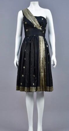 Gorgeous elegant one of a kind festive single-shoulder dress made from black and gold sari silk with floral repeat and wide border bands. Perfect dress to stand out from the crowd during the holiday season. Unlabeled and in good condition. Size XS bust 32 inches Indian Fashion Trends, Formal Evening Wear, Silk Cocktail Dress, Sari Silk, Cocktail Party Dress, 1950s Dress, Fantastic Art, Western Style, Dress Clothes For Women