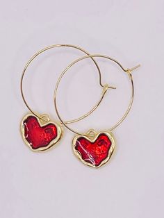 Red heart hoop earrings, gold and red heart earrings, heart hoop earrings, gold and red heart hoop earrings, valentine earrings, valentines gift These heart earrings measure 1.25 inches in diameter and the heart charm is 1/2 inches These earrings are very pretty and would make a perfect gift for that special person on Valentine's Day. Cheap Small Hoop Heart Earrings For Valentine's Day, Gold Hoop Earrings For Valentine's Day Party, Heart Shaped Metal Earrings For Valentine's Day, Heart-shaped Metal Earrings For Valentine's Day, Red Drop Earrings For Valentine's Day, Trendy Single Heart Earring For Valentine's Day, Trendy Heart-shaped Hoop Earrings For Party, Trendy Heart Hoop Earrings For Party, Trendy Round Jewelry For Valentine's Day