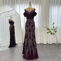 Luxury Burgundy Mermaid Design: The dress features a luxurious burgundy color in a flattering mermaid silhouette, exuding elegance and sophistication, making it an ideal choice for upscale events and special occasions. Long Formal Gown: With its long, flowing design, the dress captures a sense of elegance and refinement, ensuring you feel exquisite and refined for any wedding guest party or formal gathering. Elegant Arabic Style: Reflecting the grace of Arabic fashion, this dress seamlessly comb Purple Evening Dress With Sweep Train For Banquet, Purple Mermaid Dress For Banquet, Purple Mermaid Dress For Banquets, Purple Floor-length Mermaid Dress For Banquet, Purple Mermaid Hem Gown With Sweep Train, Purple Floor-length Mermaid Dress With Sweep Train, Elegant Burgundy Evening Dress With Sweep Train, Burgundy Floor-length Evening Dress, Elegant Purple Mermaid Dress