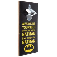 a batman door hanger that says, always be yourself unless you can be batman then always be batman