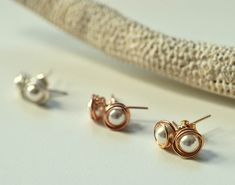 This listing is for a set of TEN pairs of wire wrapped pearl studs. I have applied a 10% discount to the price of this listing compared to the price of a single pair. You have a choice of: Sterling silver set of ten 14K gold filled set of ten 14K rose gold filled set of ten I use sterling silver or 14K gold filled materials for these dainty pearl studs. I do not work with silver or gold-plated materials as they are of inferior quality. Gold-filled jewelry has 100% more gold and the metals are fu Silver Bridesmaid Jewelry, Beach Wedding Jewelry, Bridesmaid Pearl Earrings, Pearl Jewelry Gift, Bridesmaids Jewelry, Silver Bridesmaid, Bridesmaids Gift Sets, Gold Earrings Wedding, Pearl Gifts