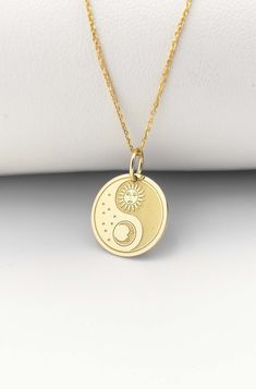 Welcome to ElegantGoldJewels,  Find all the information you need about your charm: Material of pendant: 14K Solid Gold Stamp: 585 (14K) Thickness: 0.5mm Jumpring Diameter: 4mm The pendant is available in 6 sizes: - 13mm / 0.52 inches - 15mm / 0.59 inches - 18mm / 0.70 inches - 20mm / 0.78 inches - 22mm / 0.86 inches - 24mm / 0.94 inches - 26mm / 1.02 inches - 28mm / 1.10 inches - 30mm / 1.18 inches Chains Information: Rolo Chain: -14K Real Gold - 0.70mm thick - Spring Ring Clasp - 16 inches / 40 Celestial Sun And Moon Charm Necklaces, Celestial Sun And Moon Charm Necklace, Symbolic Round Necklace With Sun And Moon Design, Spiritual Round Moon Charm Necklace, Symbolic Everyday Jewelry With Sun And Moon Design, Spiritual Round Moon Phase Charm Necklace, Everyday Symbolic Jewelry With Sun And Moon Design, Symbolic Sun And Moon Design Jewelry For Everyday, Everyday Symbolic Sun And Moon Jewelry