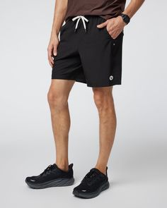 One short for every sport, the Kore Shorts have a classic athletic fit, falling just above the knee with an anywhere and everywhere versatility. Go commando in confidence with the breathable, boxer-brief liner. Also available in 5" and 9" inseam and unlined. | Vuori Kore Shorts | Black | XL Vuori makes premium performance apparel inspired by the active Coastal California lifestyle; an integration of fitness, surf, sport, and art. Breaking down the boundaries of traditional activewear, we are a n Sporty Swim Trunks With Built-in Shorts For Outdoor Activities, Black Outdoor Activewear With Built-in Shorts, Black Swim Trunks With Built-in Shorts For Outdoor Activities, Athleisure Swim Trunks With Functional Drawstring And Relaxed Fit, Athleisure Breathable Athletic Shorts In Recycled Polyester, Breathable Athleisure Athletic Shorts In Recycled Polyester, Sporty Breathable Athletic Shorts In Recycled Polyester, Athleisure Breathable Recycled Polyester Shorts, Athleisure Athletic Shorts In Recycled Polyester For Sports