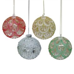 three glass ornaments hanging from strings on a white background