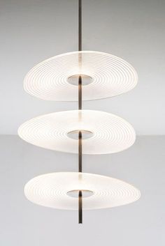 three circular lights hanging from the ceiling