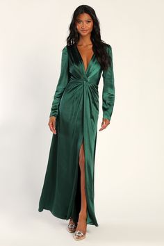 You're sure to feel beloved and beautiful from every angle when wearing the Lulus Endearing Elegance Emerald Green Satin Long Sleeve Maxi Dress! This elegant dress has a sleek satin construction that shapes long sleeves, a plunging surplice neckline, and a fitted bodice with a pleated, twist-inspired detail at the center. The high, fitted waist falls to a stunning A-line maxi skirt with an alluring thigh-high slit at the center. Hidden back zipper/clasp. Fit: This garment fits true to size. Leng Emerald Green Satin Dress, Flowy Wide Leg Pants, Green Satin Dress, Satin Long Sleeve, Pleated Maxi Dress, Long Jumpsuits, Chiffon Maxi Dress, Long Sleeve Maxi, Green Satin