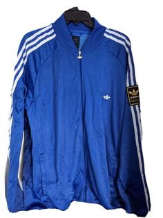 adidas Originals Label USA Men's Track Jacket   LEATHER adidas left sleeve  Trefoil 3-Stripes  Vintage Deadstock 2005 100% Authentic New With Tag Size: XL Color:  Royal/White 78% Nylon  22% Polyester  Lightweight and soft inside Embroidered Trefoil left breast Full Zipper w/metal Trefoil pull Side pockets Ribbed cuffs & waist Chest across armpit to armpit 31 inches Sleeve armpit to cuff 25 inches  Length shoulder to waist 33 inches Style Code:  576115001 International Buyers are responsible for Adidas Blue Outerwear With Three Stripes Branding, Adidas Blue Outerwear With Three Stripes, Spring Streetwear Track Jacket With Three Stripes, Adidas Blue Track Jacket With Three Stripes, Cotton Track Jacket With Three Stripes For Sports, Cotton Track Jacket With Three Stripes, Cotton Athleisure Track Jacket With Three Stripes, Adidas Cotton Track Jacket For Sports, Sporty Cotton Track Jacket With Three Stripes Branding