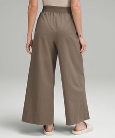 These High-Rise, Wide-Leg Crops Flow With Your Every Move For An Easy Approach To Your Daily Routine. Designed For Casual. Relaxed Fit Is Roomy Through Glutes And Thighs:sits Away From Body, Hip To Hem:intended To Sit Above Ankle. Hand Pockets With Hidden Card Sleeve. | Stretch Woven High-Rise Wide-Leg Cropped Pant Versatile Lululemon Tapered Leg Pants, Lululemon Summer Bottoms With Pockets, Versatile Lululemon Tapered Leg Bottoms, Lululemon Tapered Leg Pants With Elastic Waistband, Versatile Tapered Leg Lululemon Bottoms, Stretch Lululemon Bottoms, Versatile Relaxed Fit Lululemon Pants, Lululemon Relaxed Fit Versatile Pants, Lululemon Versatile Relaxed Fit Pants