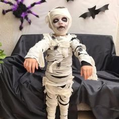 a little boy dressed up as a skeleton